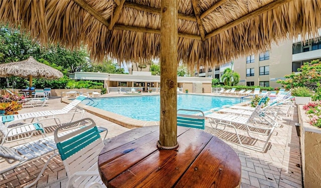 view of swimming pool featuring a gazebo and a patio