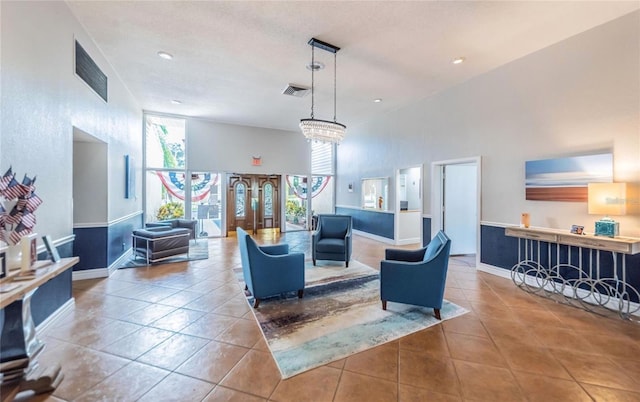 2617 Cove Cay Dr Unit 505, Clearwater, FL 33760 - living area with tile patterned floors, baseboards, a towering ceiling, and recessed lighting