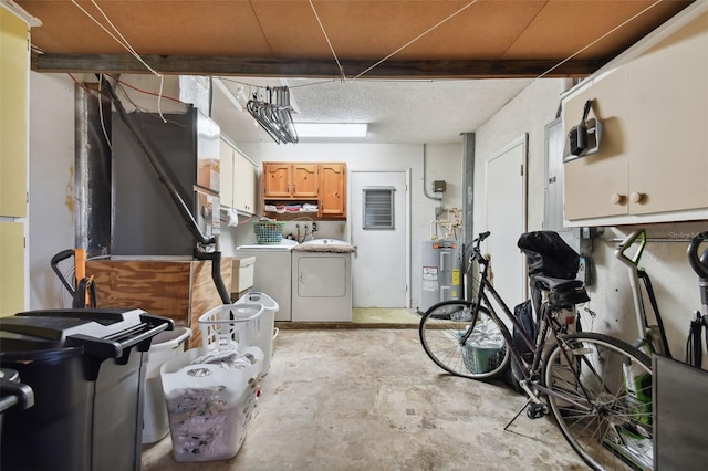 basement with washing machine and dryer and electric water heater