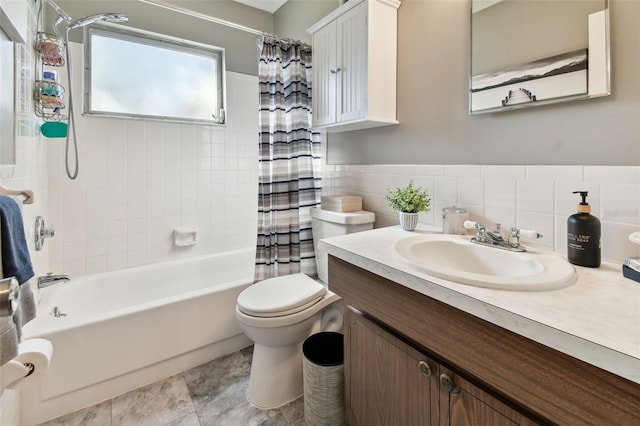 full bathroom featuring shower / bath combination with curtain, vanity, toilet, and tile walls