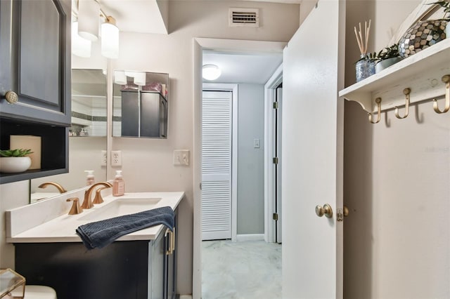 bathroom featuring vanity and concrete flooring