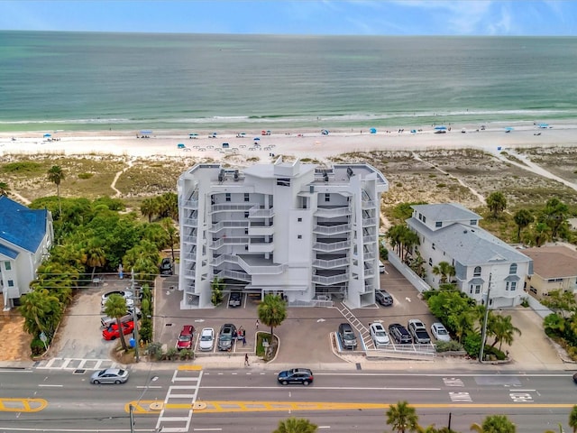 drone / aerial view featuring a view of the beach and a water view