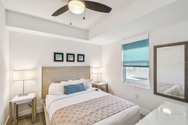 bedroom with hardwood / wood-style flooring and ceiling fan