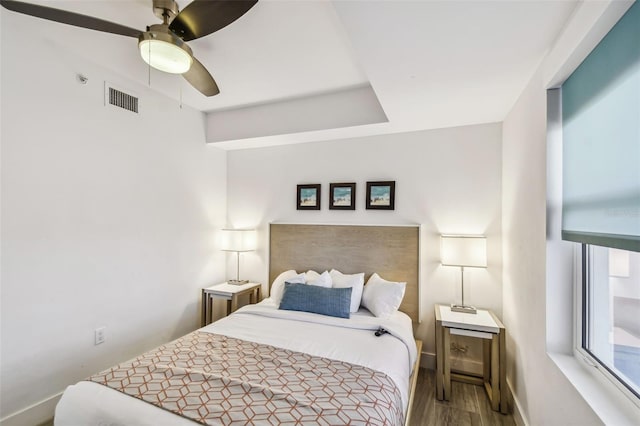 bedroom featuring ceiling fan and hardwood / wood-style flooring