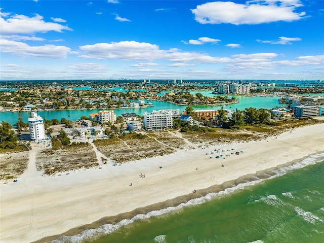 birds eye view of property featuring a water view and a beach view