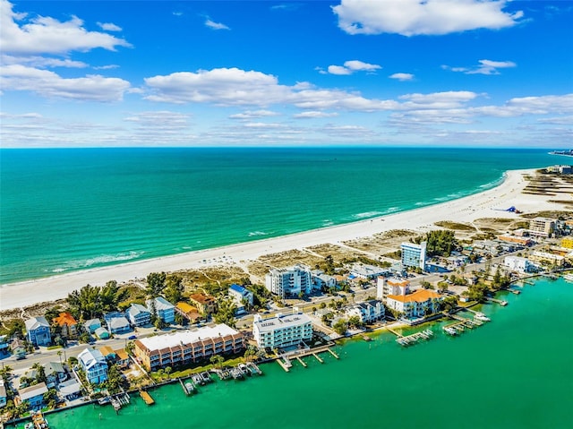 birds eye view of property with a beach view and a water view