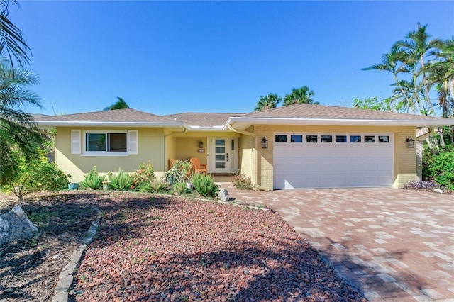 single story home with a garage