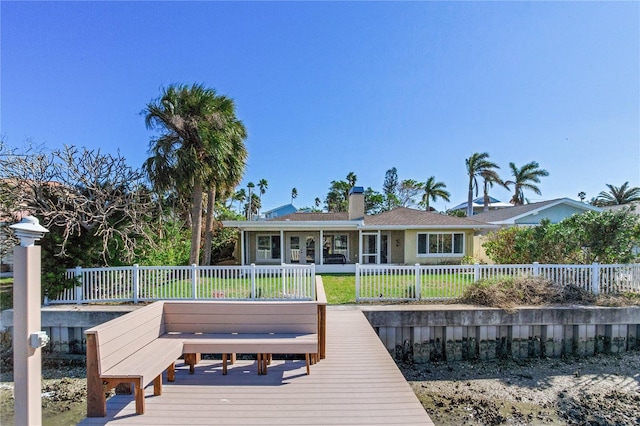 dock area with a wooden deck and a yard