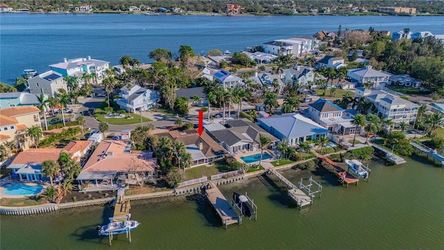 birds eye view of property with a water view