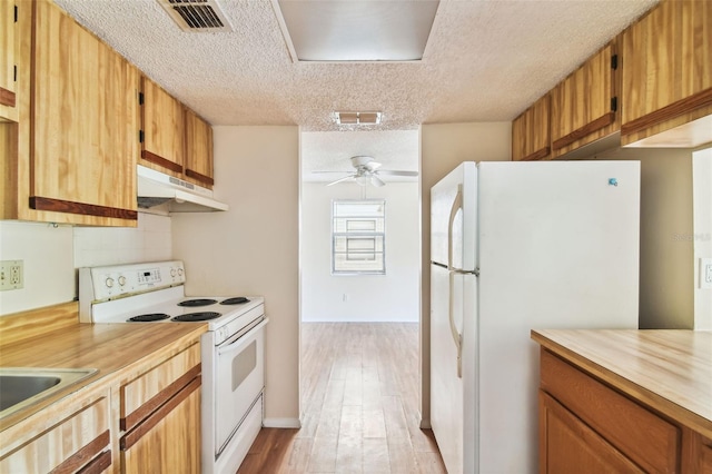 kitchen with tasteful backsplash, a textured ceiling, white appliances, ceiling fan, and light hardwood / wood-style flooring