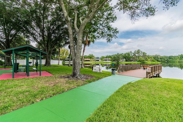 surrounding community featuring a yard and a water view