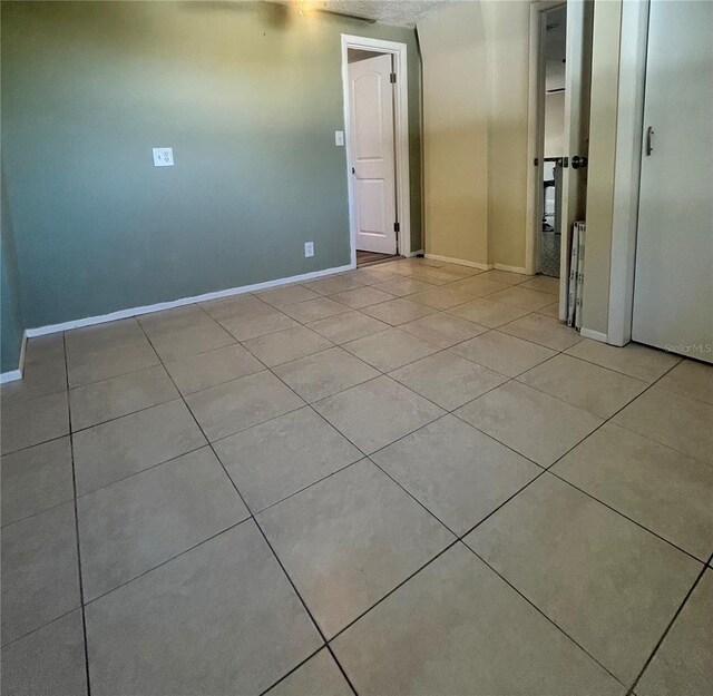 view of tiled spare room