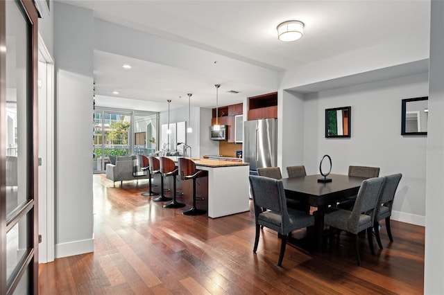 dining room featuring dark hardwood / wood-style flooring