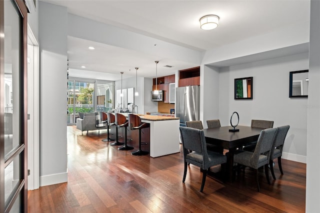912 Channelside Dr Unit 2320, Tampa, FL 33602 - dining room with dark wood-type flooring, baseboards, and recessed lighting
