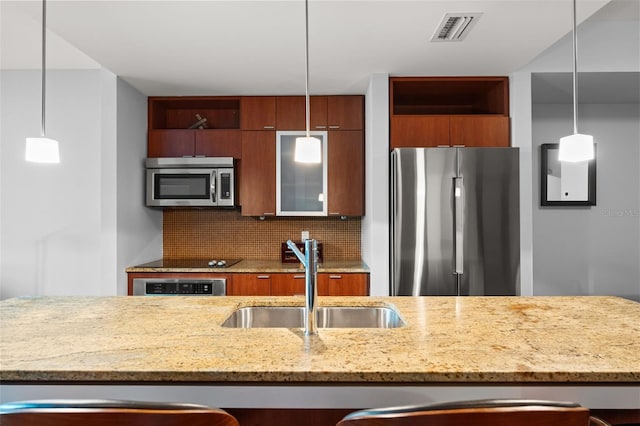 912 Channelside Dr Unit 2320, Tampa, FL 33602 - kitchen with appliances with stainless steel finishes, a sink, open shelves, backsplash, and pendant lighting