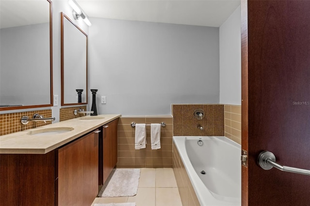 912 Channelside Dr Unit 2320, Tampa, FL 33602 - full bath featuring tile walls, tile patterned floors, double vanity, a bath, and a wainscoted wall
