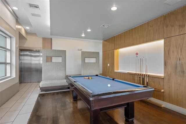 playroom with elevator, light hardwood / wood-style flooring, and billiards