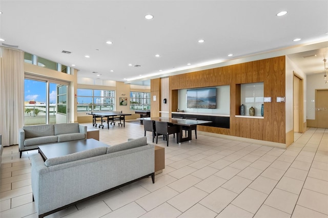 tiled living room with wood walls