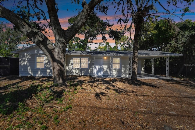 view of front of home with a carport