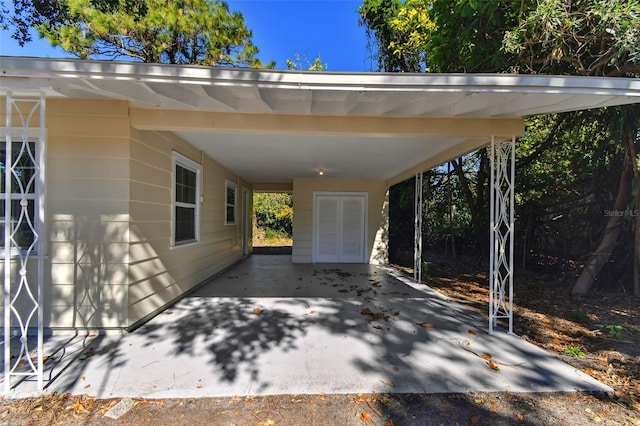 view of vehicle parking featuring a carport