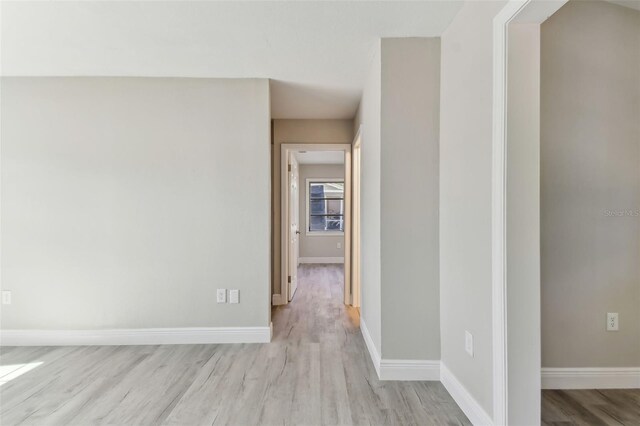 corridor featuring light hardwood / wood-style floors