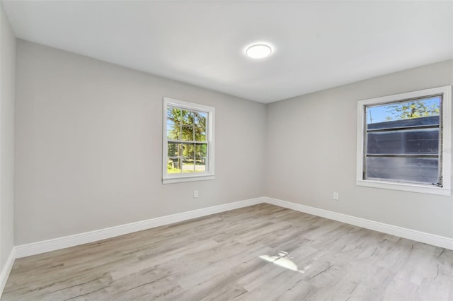 unfurnished room featuring light hardwood / wood-style floors