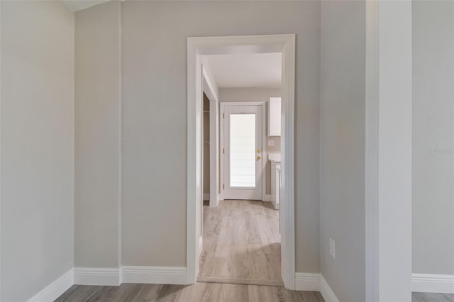 hallway with wood-type flooring