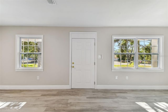 entrance foyer with light hardwood / wood-style floors