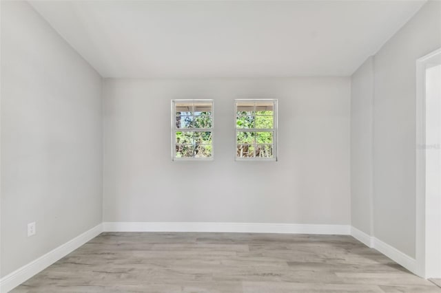 spare room featuring light wood-type flooring