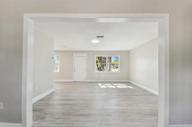 spare room with light hardwood / wood-style floors