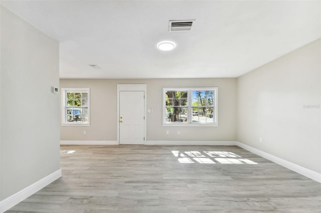 interior space featuring light hardwood / wood-style flooring and a healthy amount of sunlight