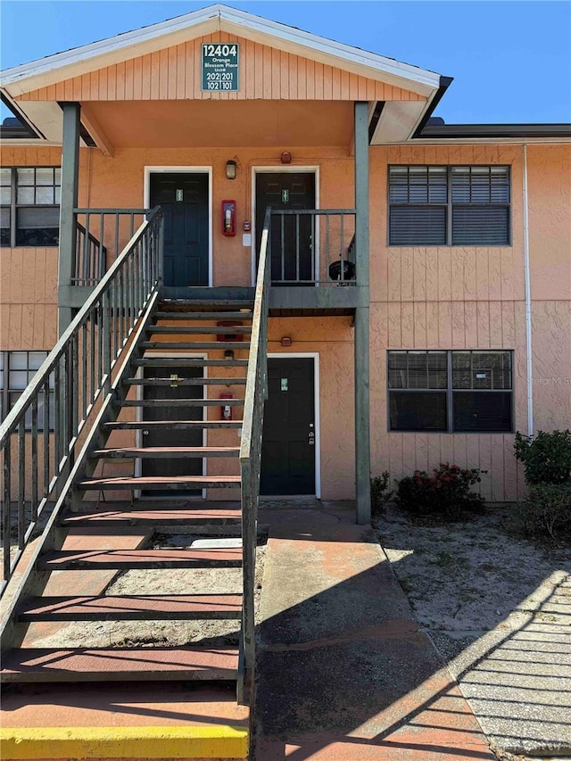 12404 Orange Blossom Oak Pl Unit 101, Tampa, FL 33612 - view of building exterior featuring stairs