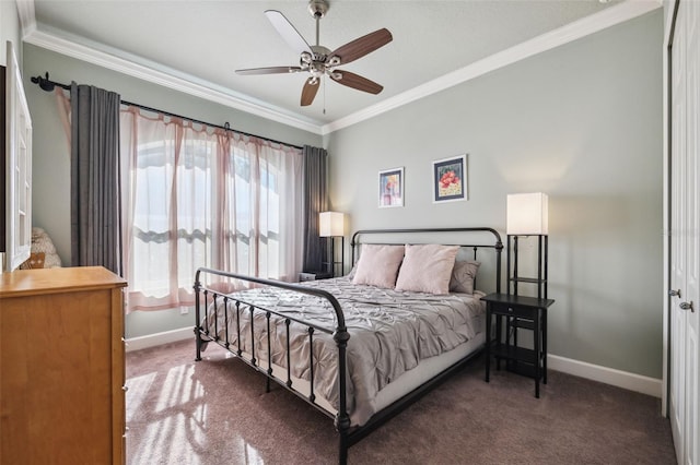 bedroom featuring crown molding, ceiling fan, and dark colored carpet