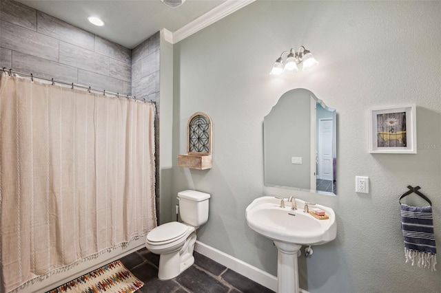 bathroom with crown molding and toilet