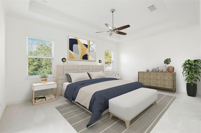 34 Concord Dr, Dunedin, FL 34698 - carpeted bedroom with a tray ceiling, multiple windows, and a ceiling fan