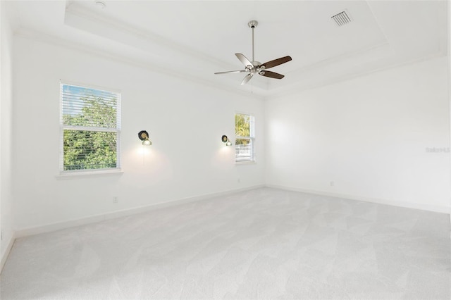 34 Concord Dr, Dunedin, FL 34698 - empty room with a raised ceiling, plenty of natural light, light colored carpet, and a ceiling fan