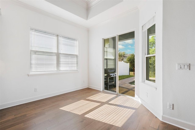34 Concord Dr, Dunedin, FL 34698 - unfurnished room with crown molding, hardwood / wood-style flooring, and baseboards