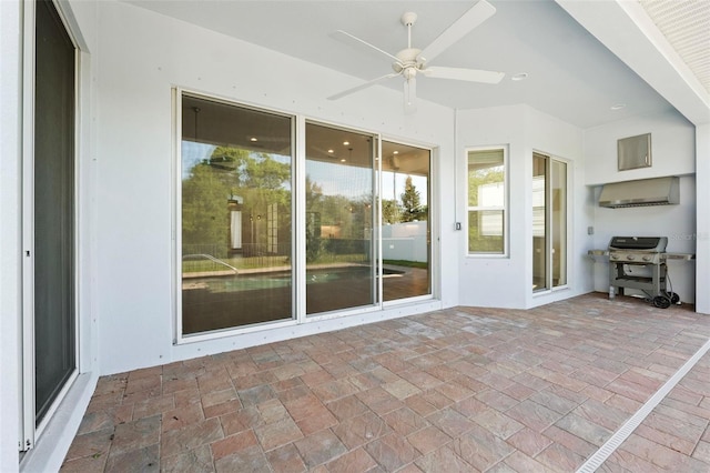 34 Concord Dr, Dunedin, FL 34698 - unfurnished sunroom featuring ceiling fan