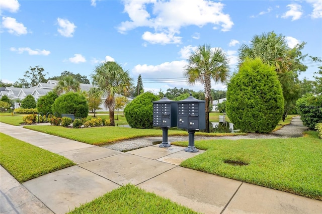 34 Concord Dr, Dunedin, FL 34698 - view of home's community with mail area and a lawn