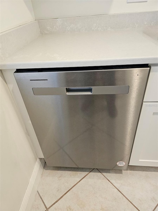 interior details with dishwasher and white cabinets