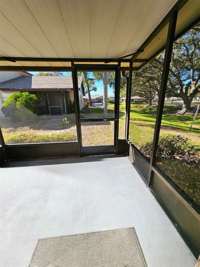 unfurnished sunroom with wooden ceiling