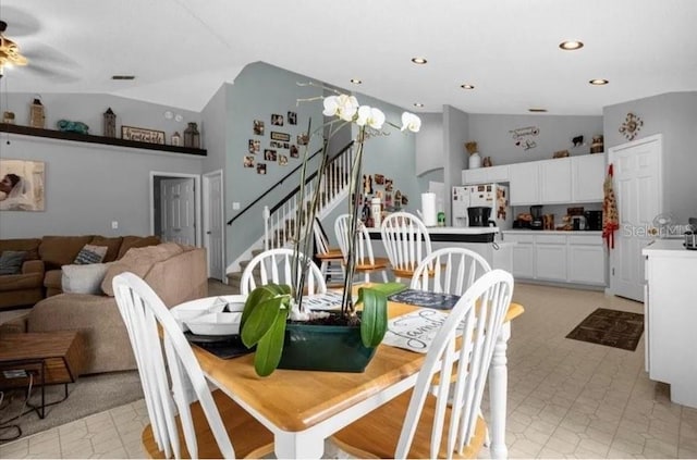 dining area featuring ceiling fan and lofted ceiling