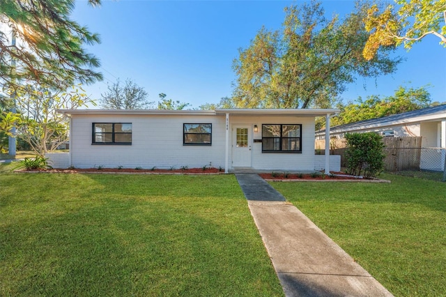 ranch-style house with a front lawn