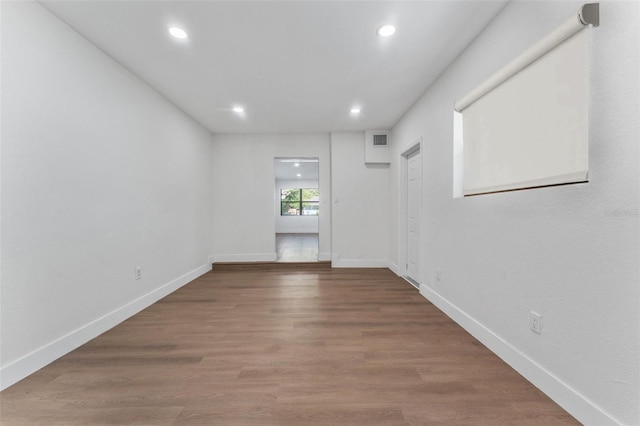 unfurnished room featuring hardwood / wood-style floors