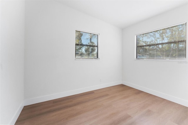 spare room featuring light wood-type flooring