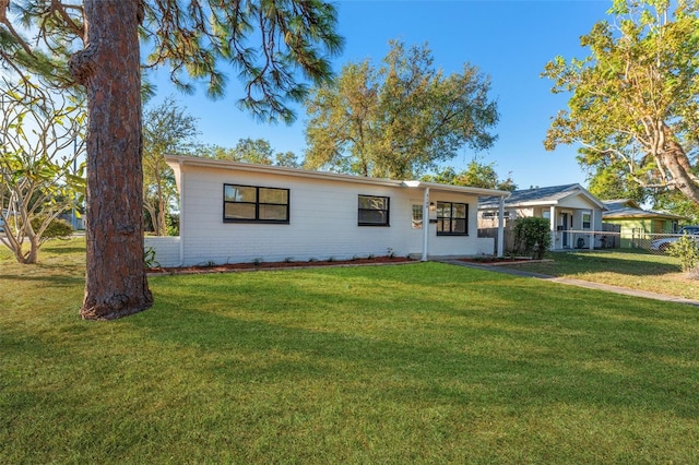 ranch-style home with a front yard