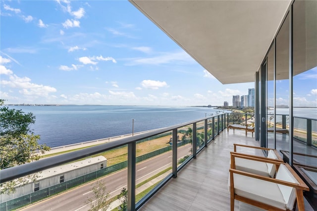 balcony featuring a water view