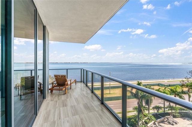 balcony featuring a water view