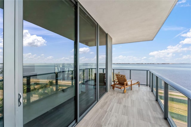 balcony featuring a water view