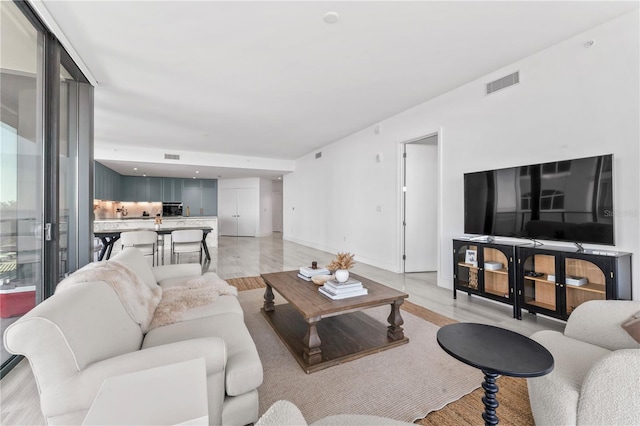 living room with light hardwood / wood-style floors